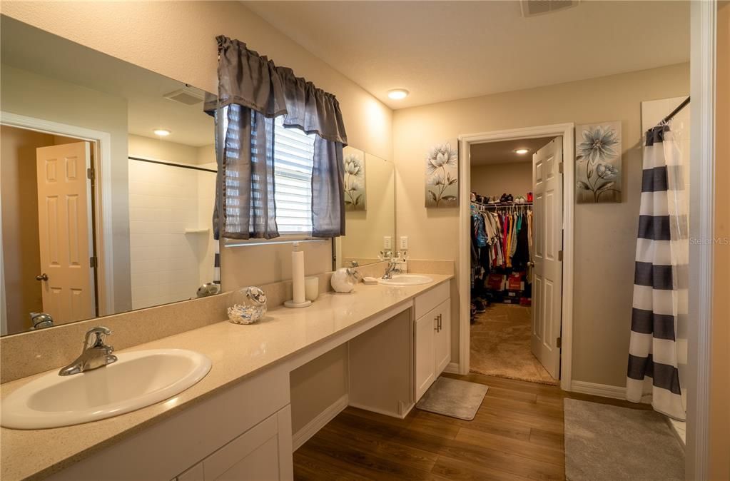 Bathroom, Dual Sink Vanities, Interior, Recessed Lighting, Walk-in Closets, Wood Texture Flooring