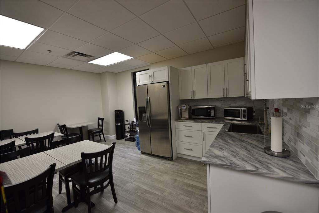 Dining room, Interior, Kitchen, Recessed Lighting, Stainless Steel Appliances, Wood Texture Flooring
