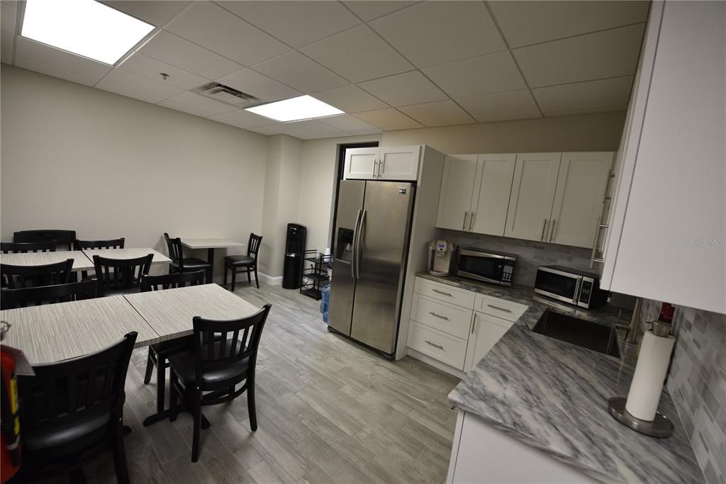 Dining room, Interior, Kitchen, Recessed Lighting, Stainless Steel Appliances, Wood Texture Flooring