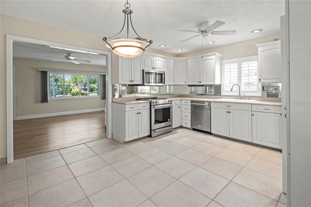 Interior, Kitchen, Pendant Lights, Recessed Lighting, Stainless Steel Appliances, Wood Texture Flooring