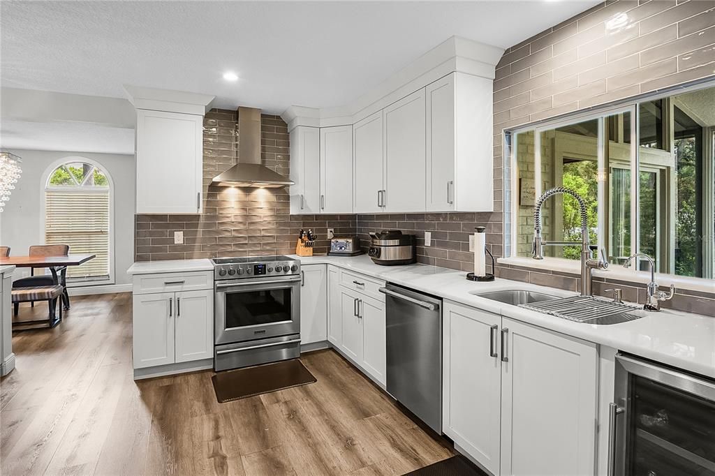 Dining room, Interior, Kitchen, Recessed Lighting, Stainless Steel Appliances, Wood Texture Flooring