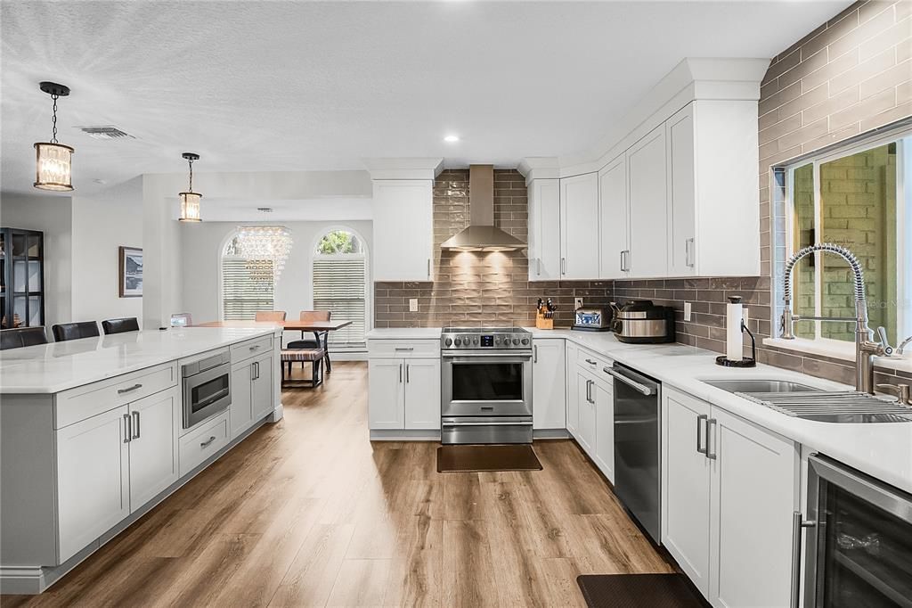 Dining room, Interior, Kitchen, Pendant Lights, Recessed Lighting, Stainless Steel Appliances, Wood Texture Flooring