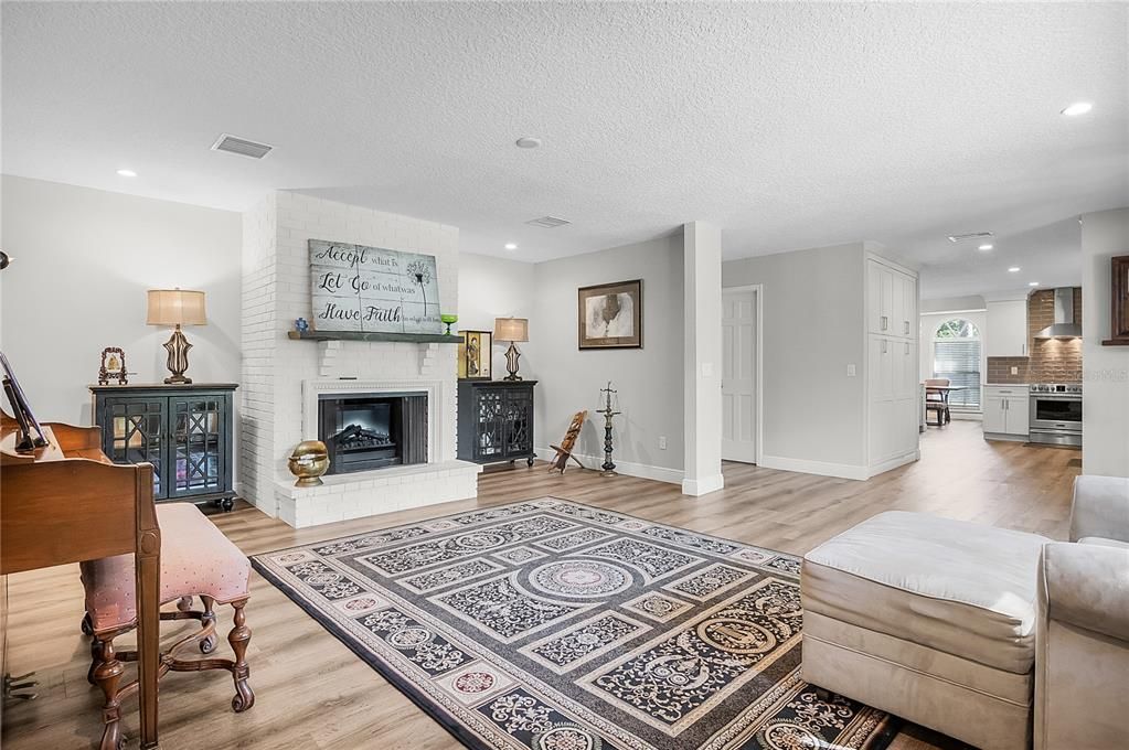 Fireplace, Interior, Kitchen, Recessed Lighting, Wood Texture Flooring