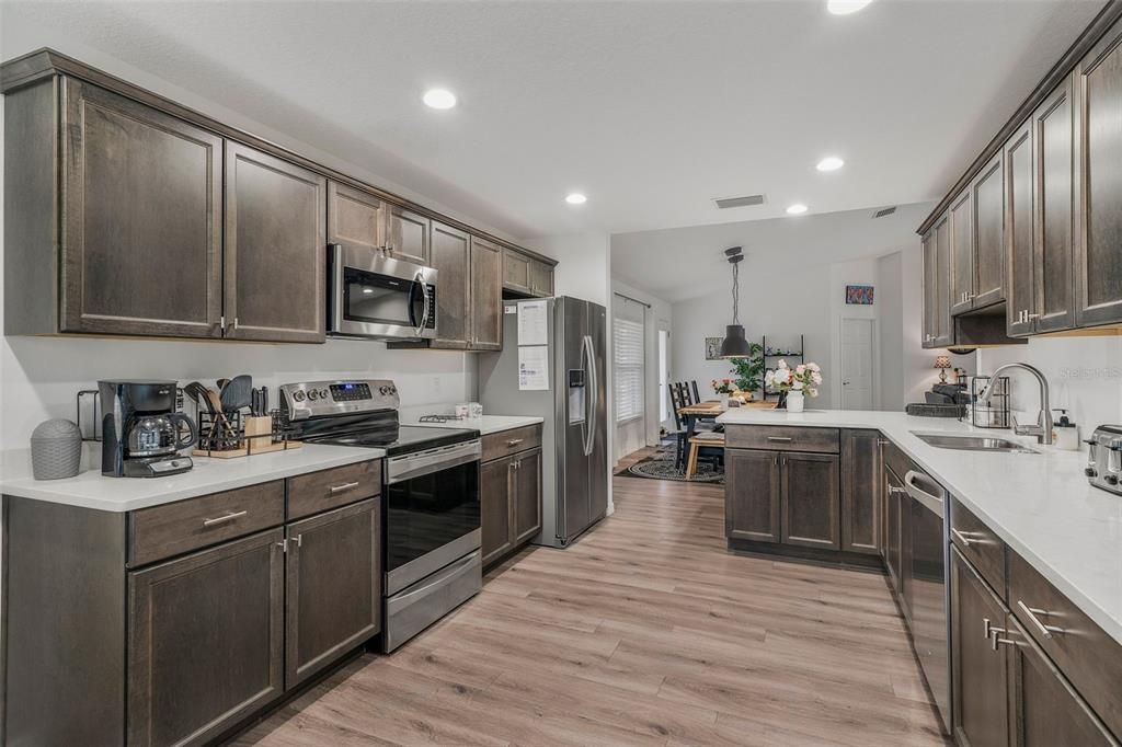 Dining room, Interior, Kitchen, Pendant Lights, Recessed Lighting, Stainless Steel Appliances, Wood Texture Flooring