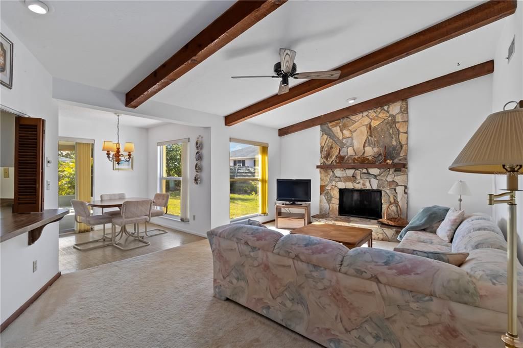 Dining room, Fireplace, Interior, Living room, Recessed Lighting, Stone Walls, Wooden Beams