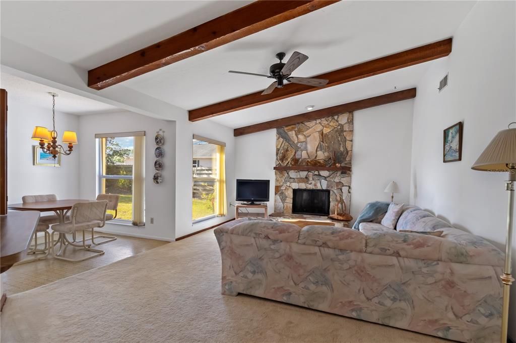 Dining room, Fireplace, Interior, Living room, Recessed Lighting, Stone Walls, Wooden Beams