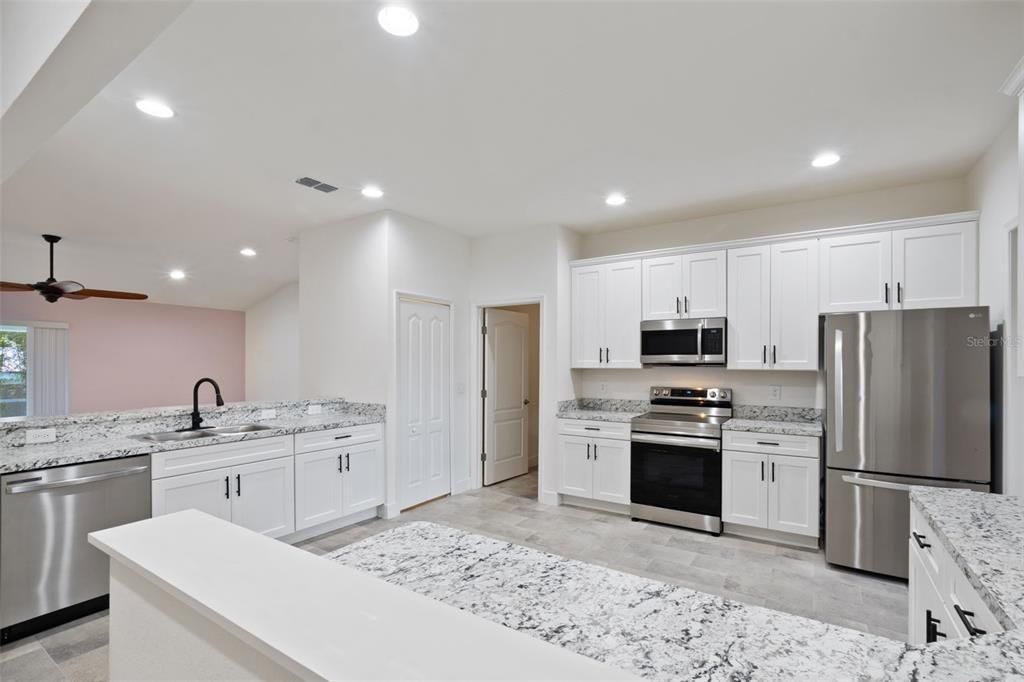 Interior, Kitchen, Recessed Lighting, Stainless Steel Appliances, Wood Texture Flooring