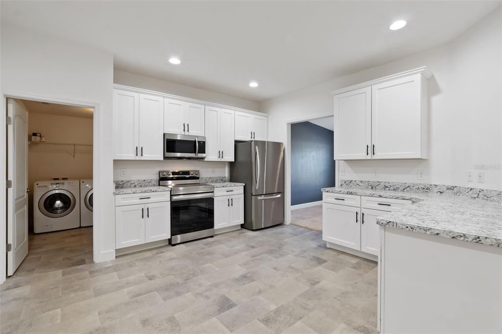 Interior, Kitchen, Recessed Lighting, Stainless Steel Appliances, Washer, Wood Texture Flooring