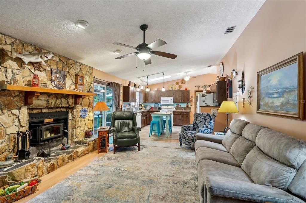 Fireplace, Interior, Kitchen, Living room, Pendant Lights, Recessed Lighting, Stone Walls, Wood Texture Flooring