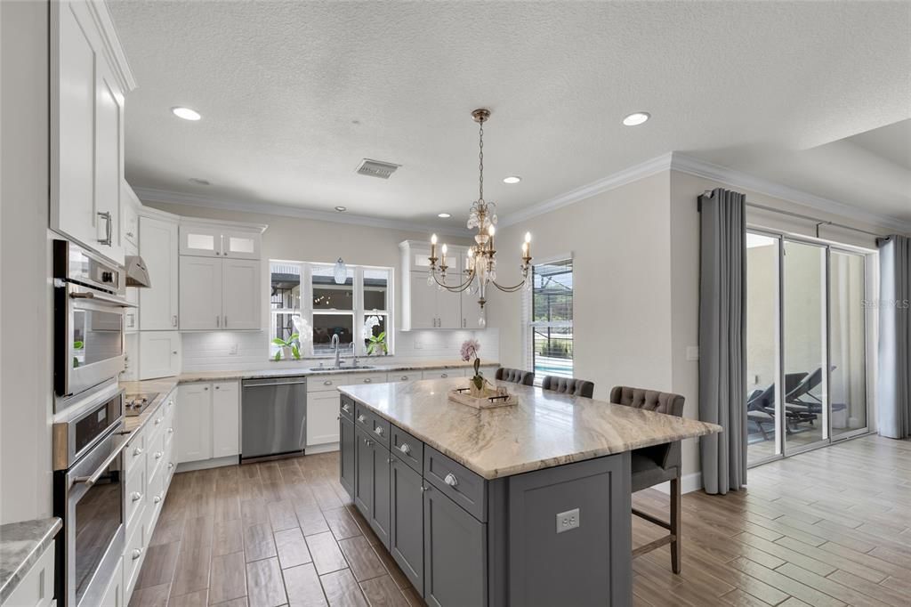 Chandelier, Interior, Kitchen, Recessed Lighting, Stainless Steel Appliances, Wood Texture Flooring