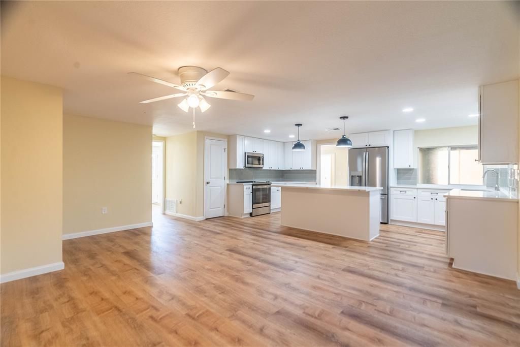 Interior, Kitchen, Pendant Lights, Recessed Lighting, Stainless Steel Appliances, Wood Texture Flooring