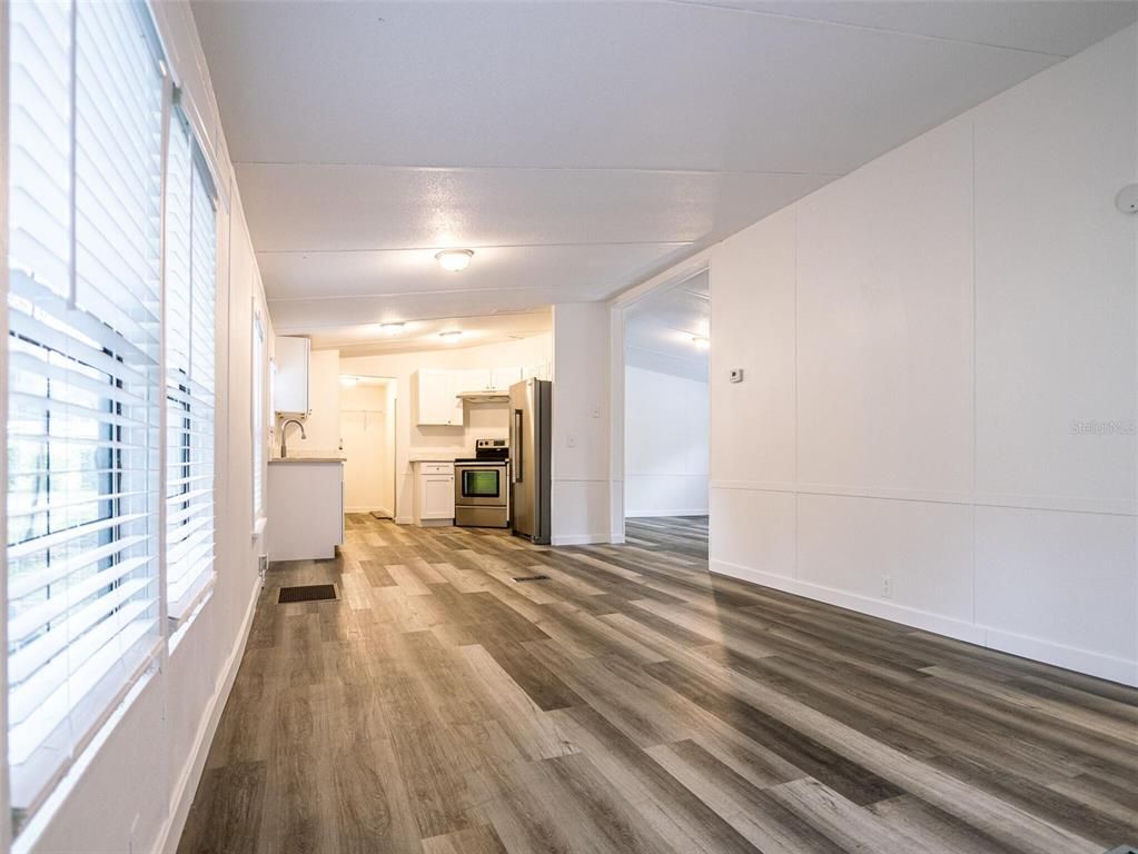 Empty room, Interior, Kitchen, Stainless Steel Appliances, Wood Texture Flooring