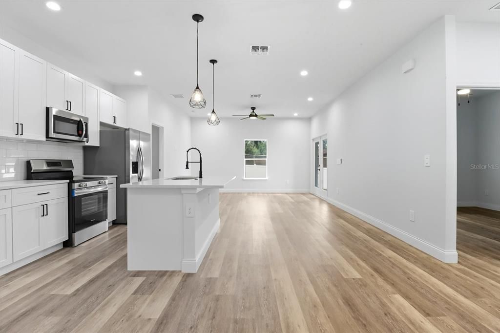 Interior, Kitchen, Pendant Lights, Recessed Lighting, Stainless Steel Appliances, Wood Texture Flooring