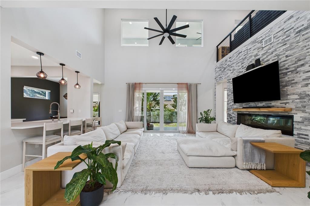 Dining room, Fireplace, Interior, Living room, Marble, Pendant Lights, Recessed Lighting, Stone Walls