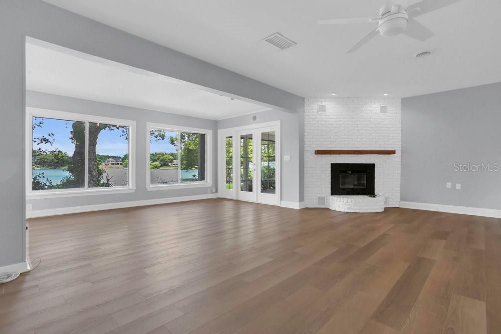 Empty room, Fireplace, Interior, Recessed Lighting, Water, Wood Texture Flooring