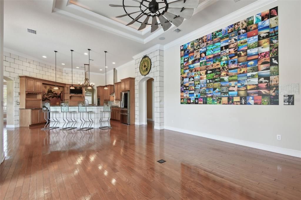 Empty room, Interior, Kitchen, Pendant Lights, Recessed Lighting, Stainless Steel Appliances, Wood Texture Flooring
