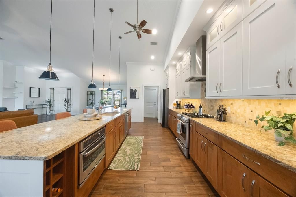Dining room, Interior, Kitchen, Pendant Lights, Recessed Lighting, Stainless Steel Appliances, Wood Texture Flooring