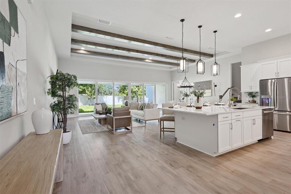 Dining room, Interior, Kitchen, Living room, Pendant Lights, Recessed Lighting, Stainless Steel Appliances, Wooden Beams, Wood Texture Flooring