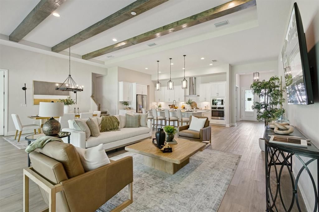 Chandelier, Dining room, Interior, Kitchen, Living room, Pendant Lights, Recessed Lighting, Stainless Steel Appliances, Wooden Beams, Wood Texture Flooring