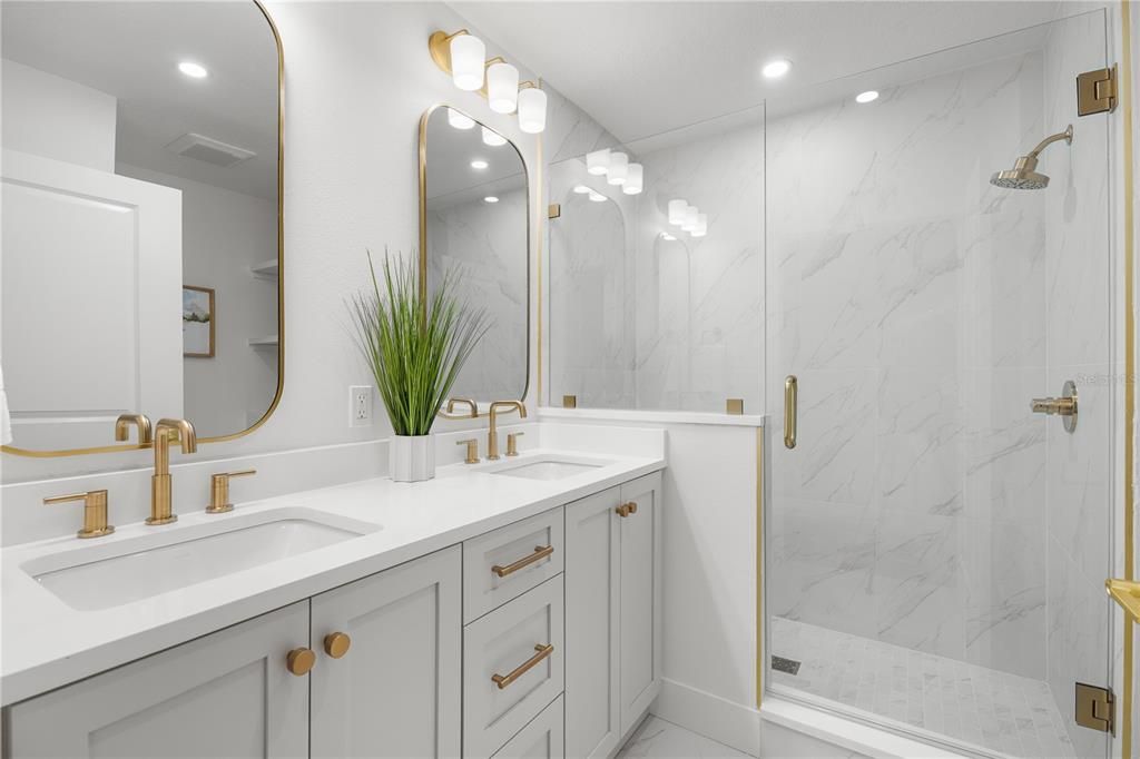 Bathroom, Dual Sink Vanities, Glass Shower, Interior, Marble Walls, Recessed Lighting