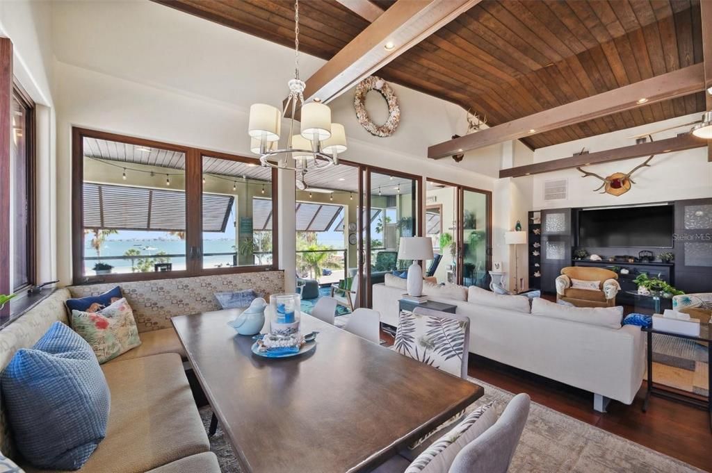 Chandelier, Dining room, Fireplace, Interior, Living room, Pendant Lights, Recessed Lighting, Wooden Beams, Wooden Ceilings, Wood Texture Flooring