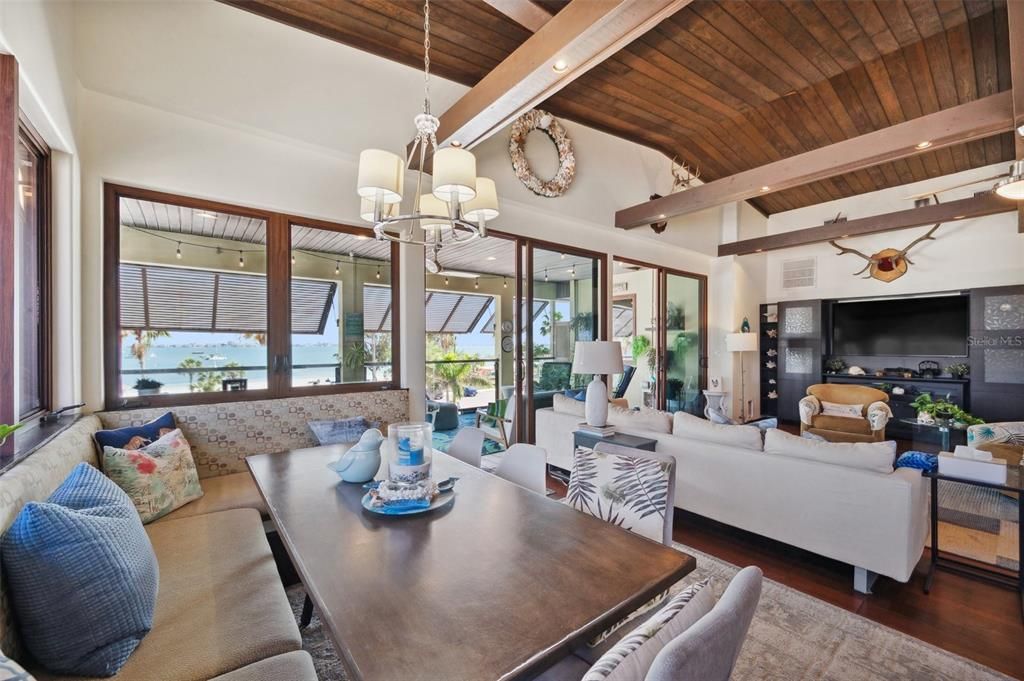 Chandelier, Dining room, Fireplace, Interior, Living room, Pendant Lights, Recessed Lighting, Wooden Beams, Wooden Ceilings, Wood Texture Flooring