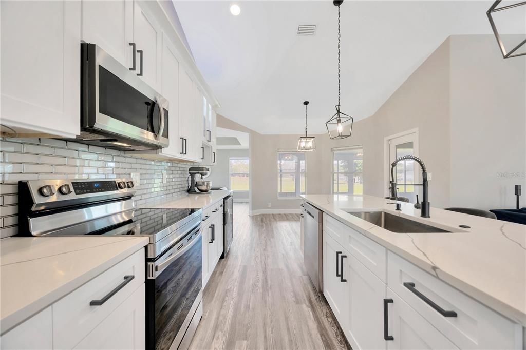 Interior, Kitchen, Pendant Lights, Recessed Lighting, Stainless Steel Appliances, Wood Texture Flooring