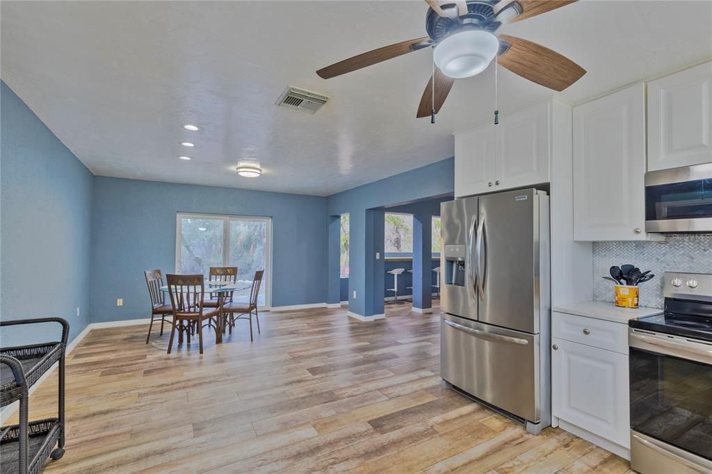 Dining room, Interior, Kitchen, Recessed Lighting, Stainless Steel Appliances, Wood Texture Flooring
