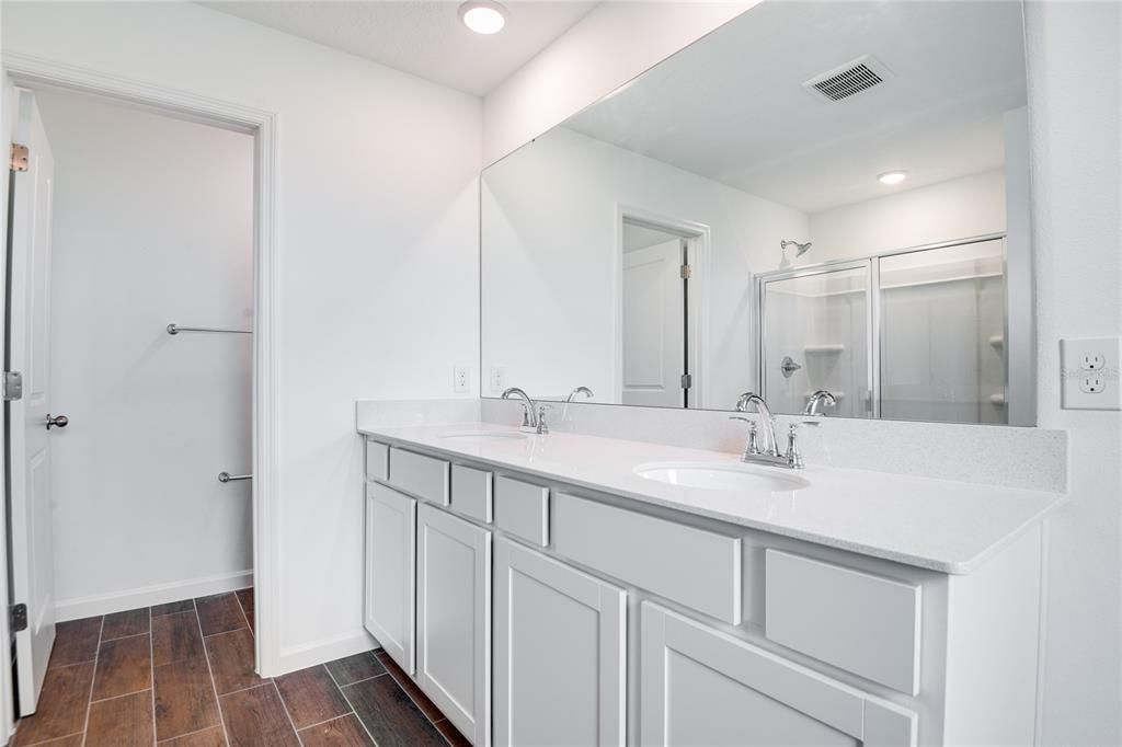Bathroom, Dual Sink Vanities, Interior, Recessed Lighting, Wood Texture Flooring