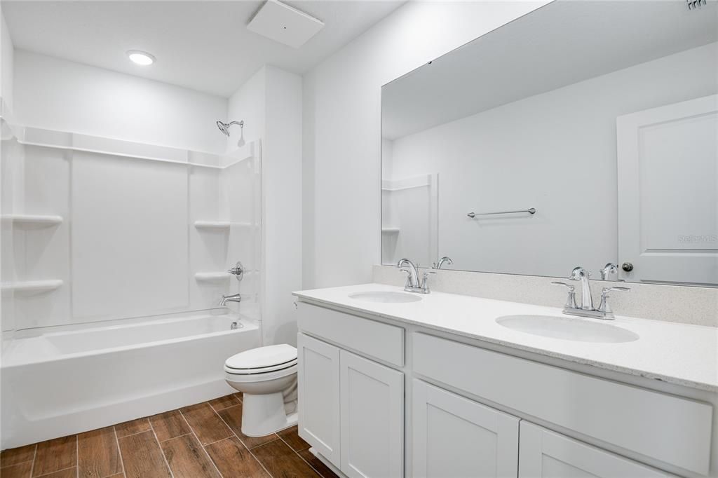 Bathroom, Dual Sink Vanities, Interior, Recessed Lighting, Wood Texture Flooring