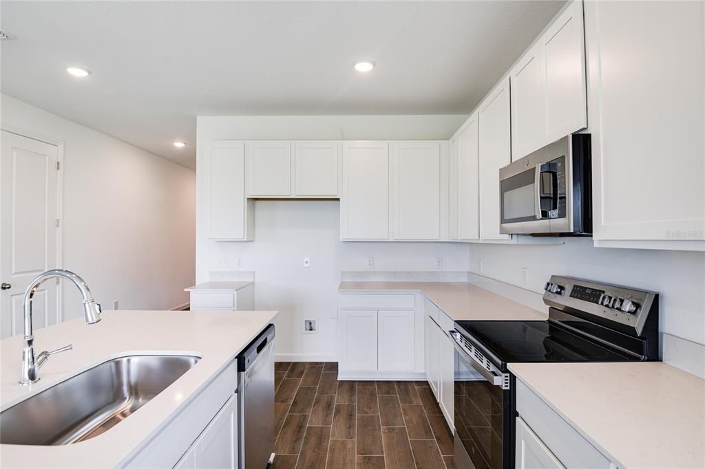 Interior, Kitchen, Recessed Lighting, Stainless Steel Appliances, Wood Texture Flooring