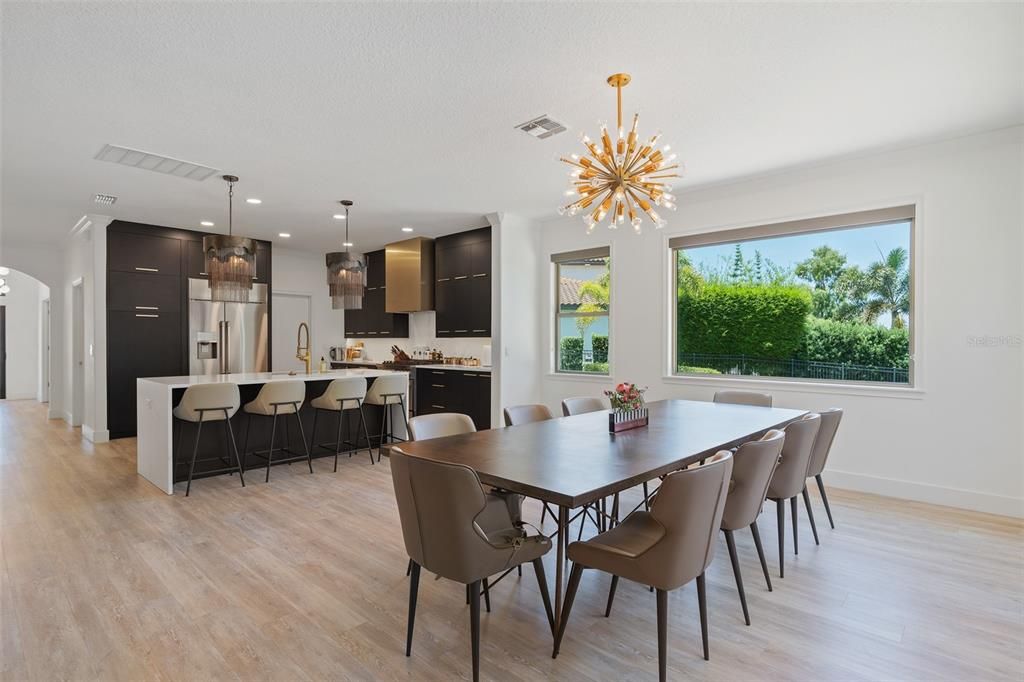 Dining room, Interior, Kitchen, Pendant Lights, Recessed Lighting, Stainless Steel Appliances, Wood Texture Flooring