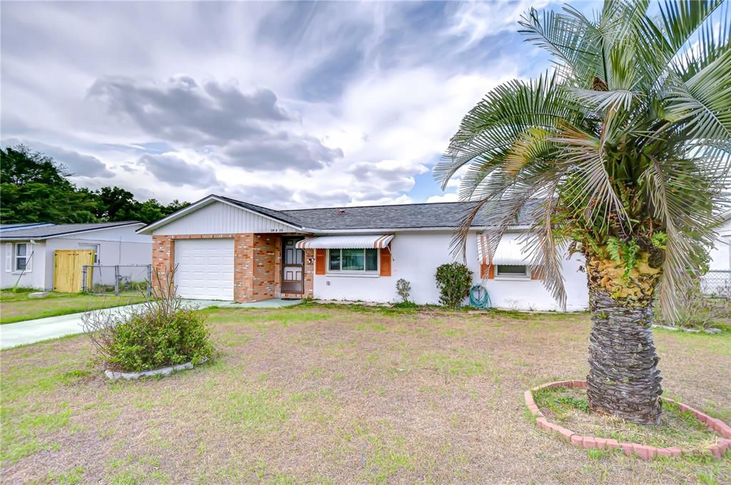 Attached, Backyard, Exterior, Facade, Brick Facade, Ranch