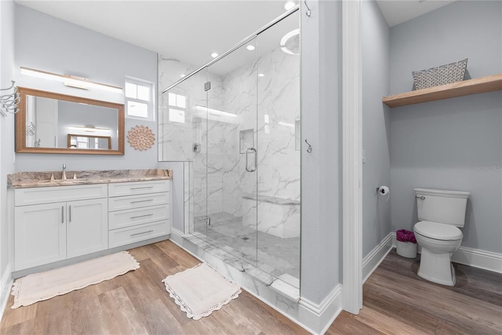 Bathroom, Glass Shower, Interior, Marble, Marble Walls, Recessed Lighting, Wood Texture Flooring