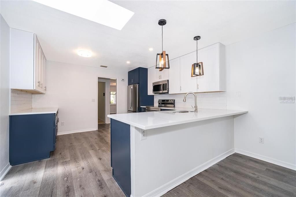 Interior, Kitchen, Pendant Lights, Recessed Lighting, Stainless Steel Appliances, Wood Texture Flooring