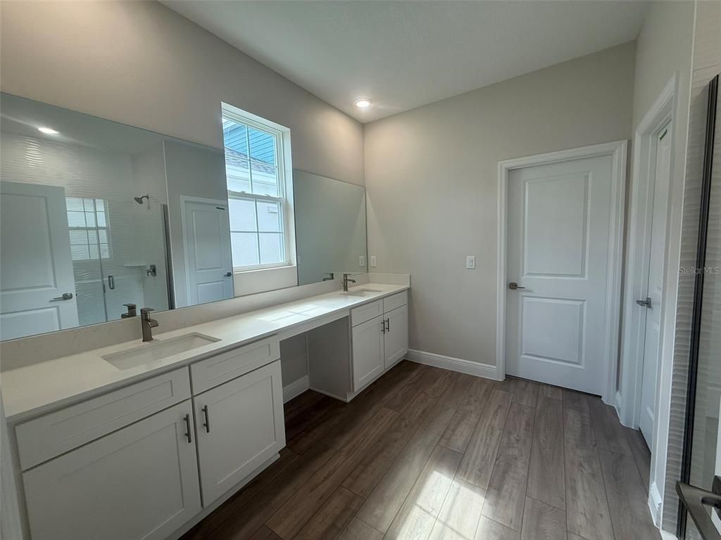Bathroom, Dual Sink Vanities, Interior, Recessed Lighting, Wood Texture Flooring