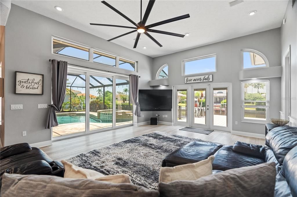 Fireplace, Interior, Living room, Recessed Lighting, Sun Room, Wood Texture Flooring