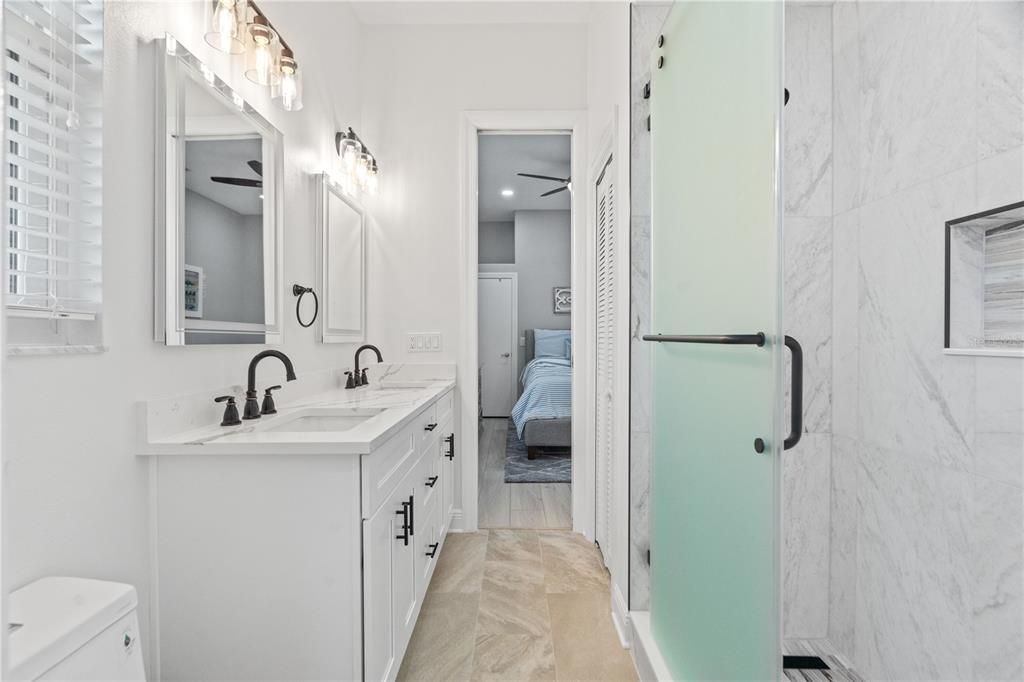 Bathroom, Bedroom, Dual Sink Vanities, Glass Shower, Interior, Marble Walls, Recessed Lighting