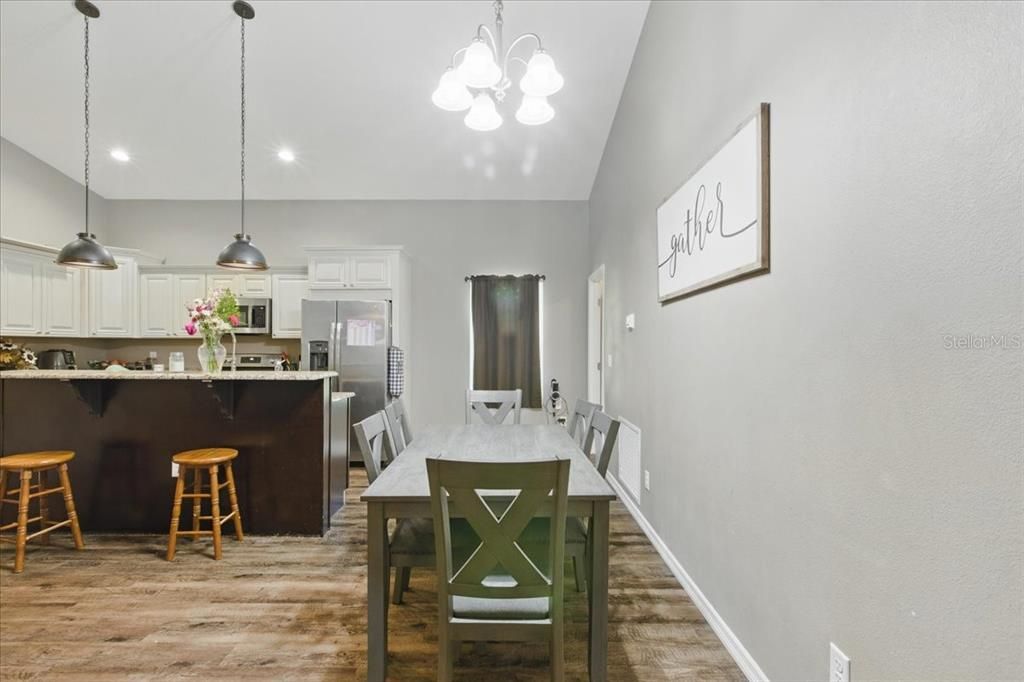 Dining room, Interior, Kitchen, Pendant Lights, Recessed Lighting, Stainless Steel Appliances, Wood Texture Flooring