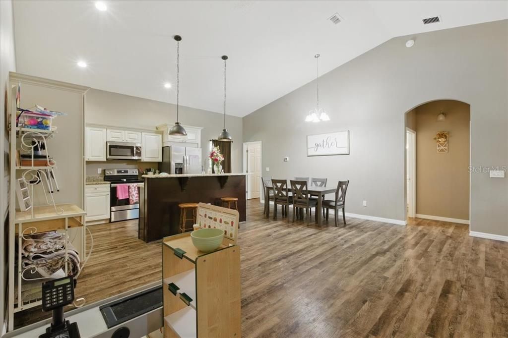 Dining room, Interior, Kitchen, Pendant Lights, Recessed Lighting, Stainless Steel Appliances, Wood Texture Flooring