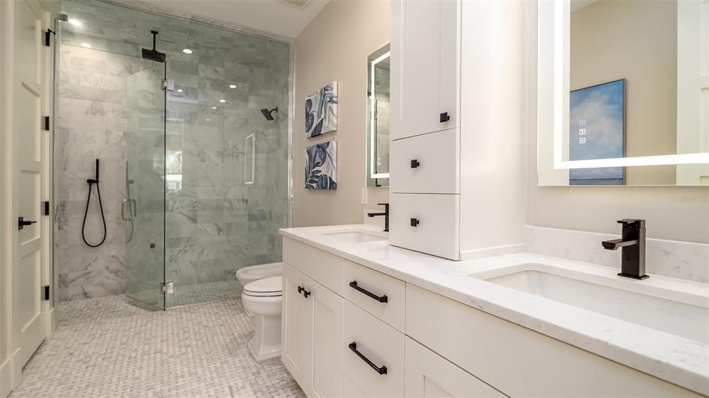 Bathroom, Dual Sink Vanities, Glass Shower, Interior, Marble Walls, Recessed Lighting