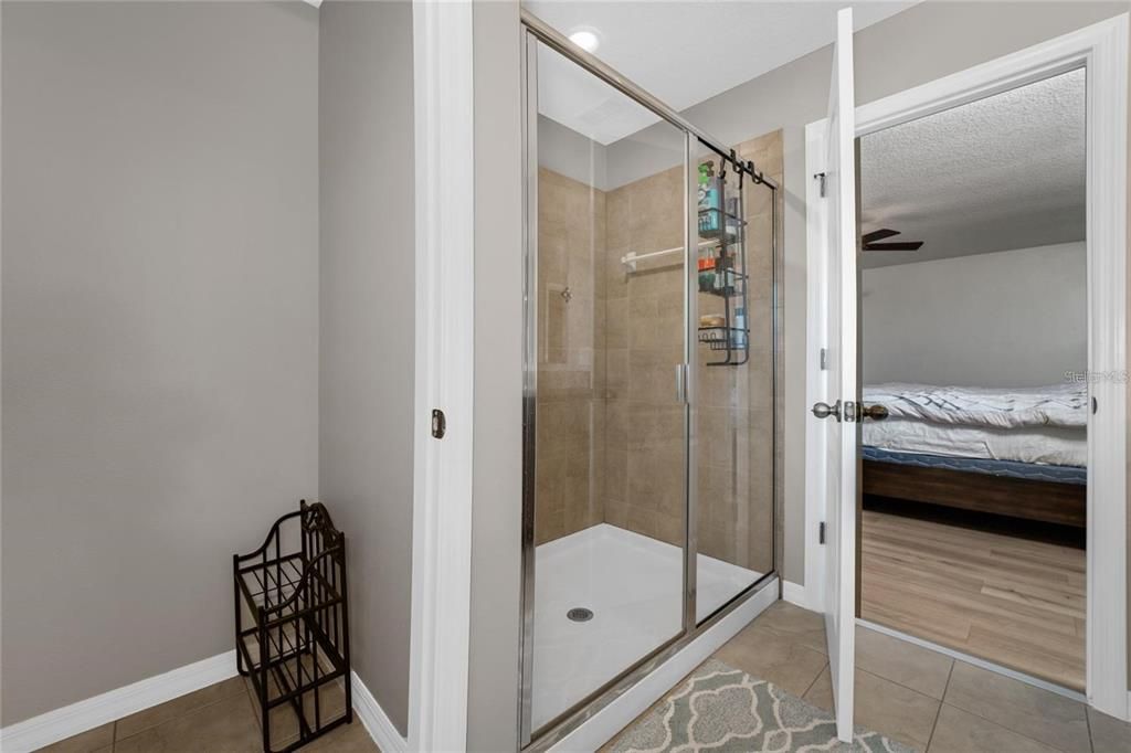 Bathroom, Bedroom, Glass Shower, Interior, Recessed Lighting, Wood Texture Flooring