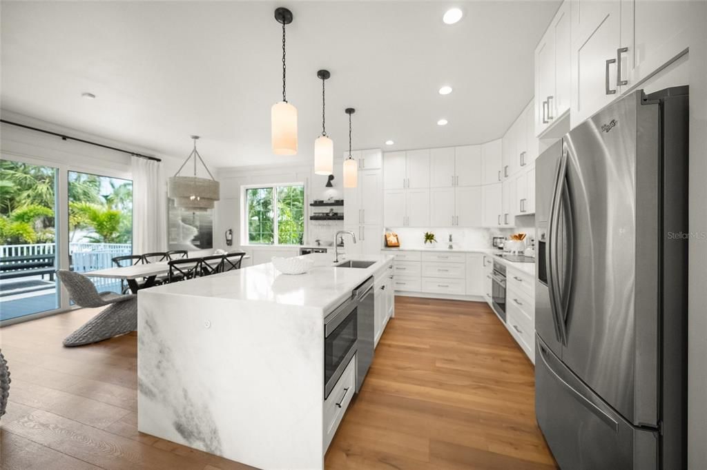 Dining room, Interior, Kitchen, Pendant Lights, Recessed Lighting, Stainless Steel Appliances, Wood Texture Flooring