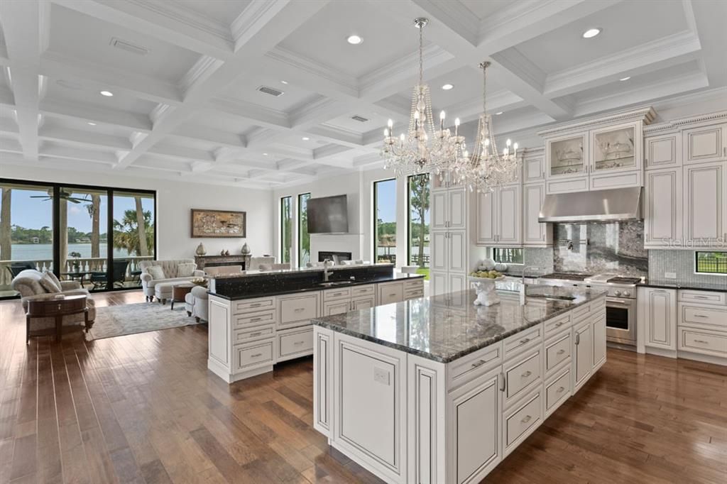 Chandelier, Interior, Kitchen, Living room, Recessed Lighting, Stainless Steel Appliances, Wood Texture Flooring