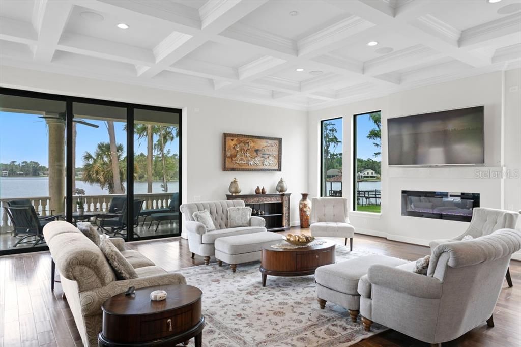 Fireplace, Interior, Living room, Recessed Lighting, Water, Wood Texture Flooring