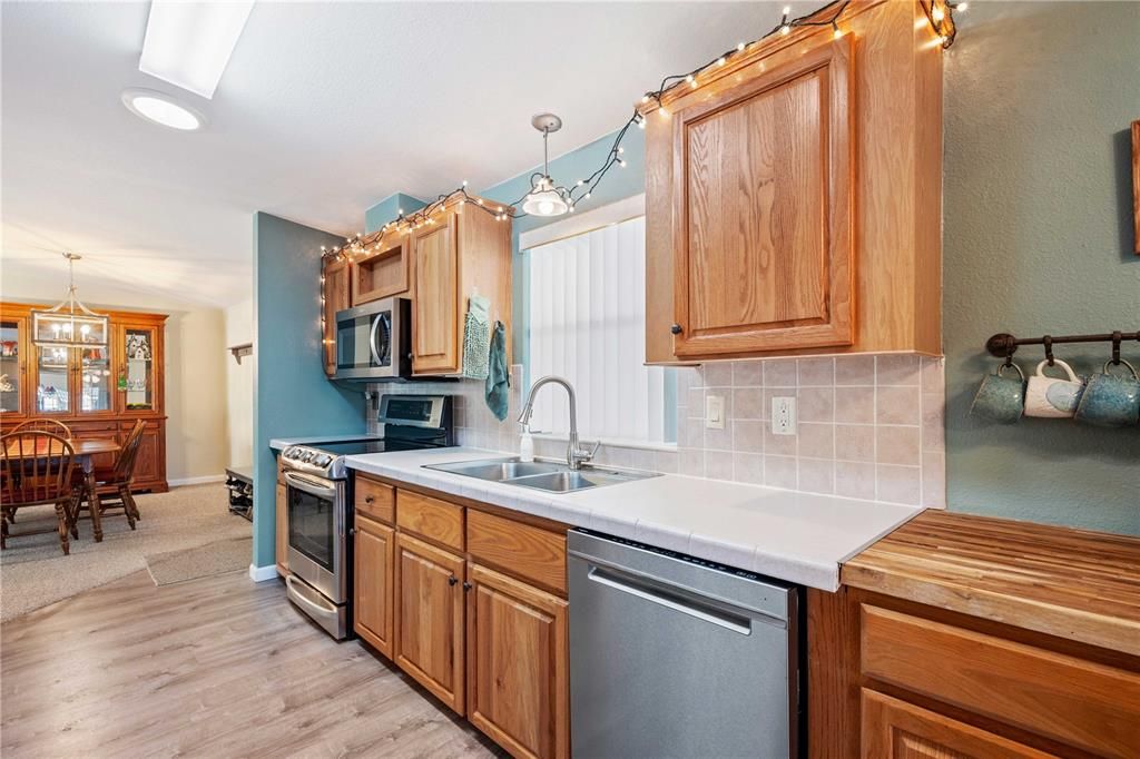 Dining room, Interior, Kitchen, Pendant Lights, Recessed Lighting, Stainless Steel Appliances, Wood Texture Flooring
