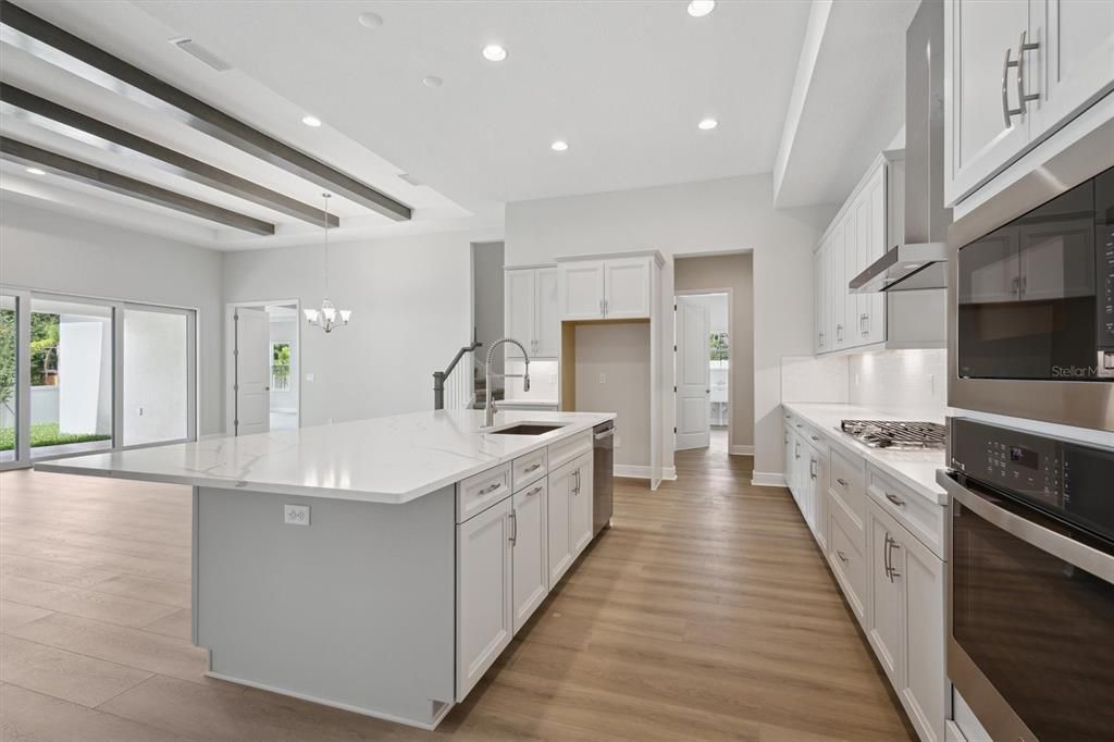 Chandelier, Interior, Kitchen, Pendant Lights, Recessed Lighting, Stainless Steel Appliances, Wood Texture Flooring