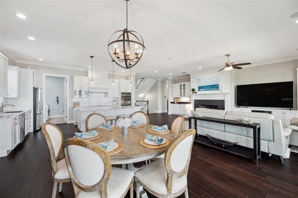 Chandelier, Dining room, Fireplace, Interior, Kitchen, Living room, Pendant Lights, Recessed Lighting, Wood Texture Flooring