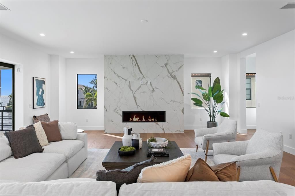 Fireplace, Interior, Living room, Marble Walls, Recessed Lighting, Wood Texture Flooring