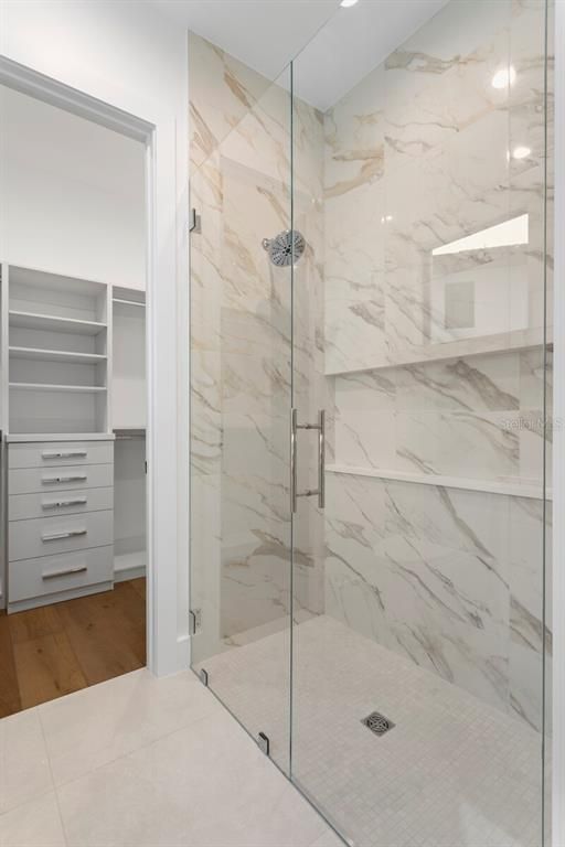 Bathroom, Glass Shower, Interior, Marble Walls, Wood Texture Flooring